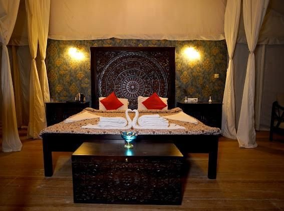 Luxury tent bedroom with mandala headboard
